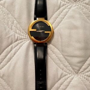 Gucci Black and Gold Timepiece